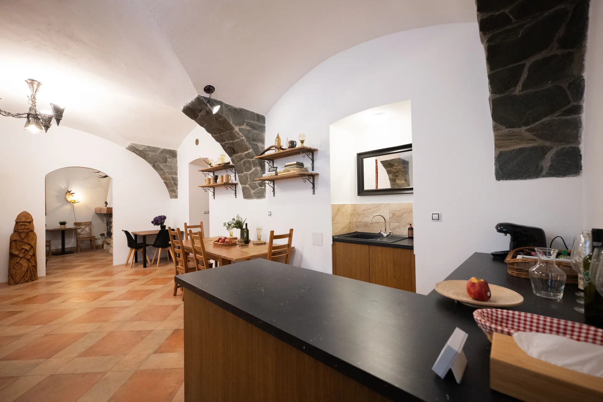 The shared kitchen opening into the dining room