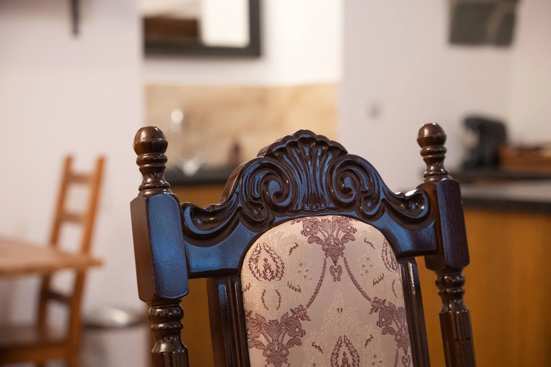 Detail of a carved historic-style wooden chair